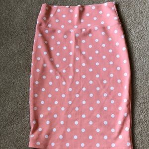 Small Cassie. Peach color with white polka dots.